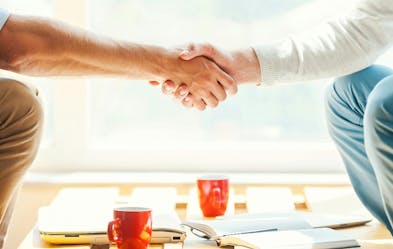 People shaking hands.