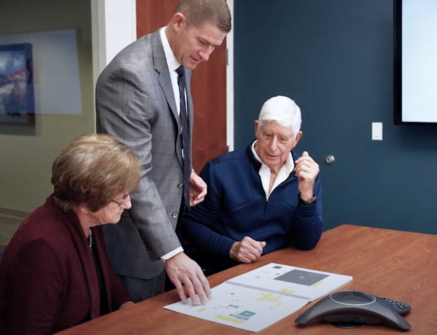 Financial planner working with clients.